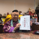 Li Kui-ming, feng shui master-turned Cantonese opera playwright, with the script of 'Trump on Show'.